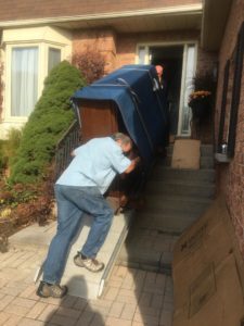 Piano moving down a ramp